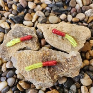 Three red and yellow fishing lures.