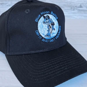 Black cap with a blue patch featuring a wolf and the phrase 'The Moon Said, Let's Ride Out Tonight'.